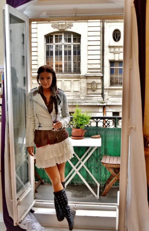 Paris balcony table set with simple market breakfast and wine