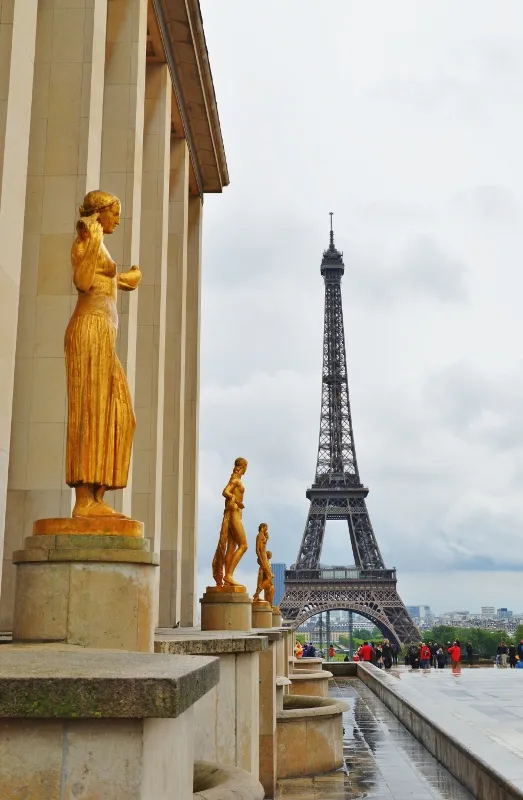 Eiffel Tower rising above Paris in dramatic light