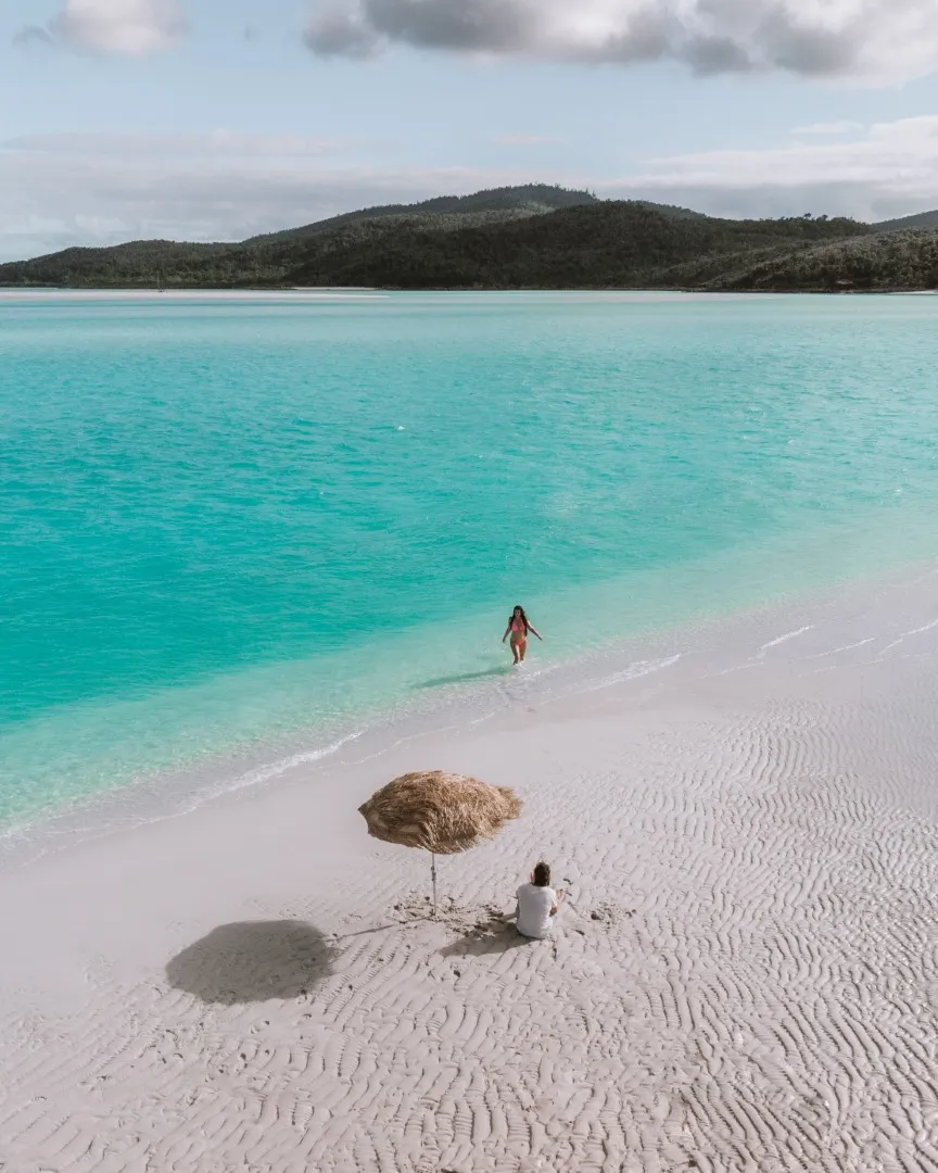 Drone view over Whitehaven Beach with white sand and turquoise shallows