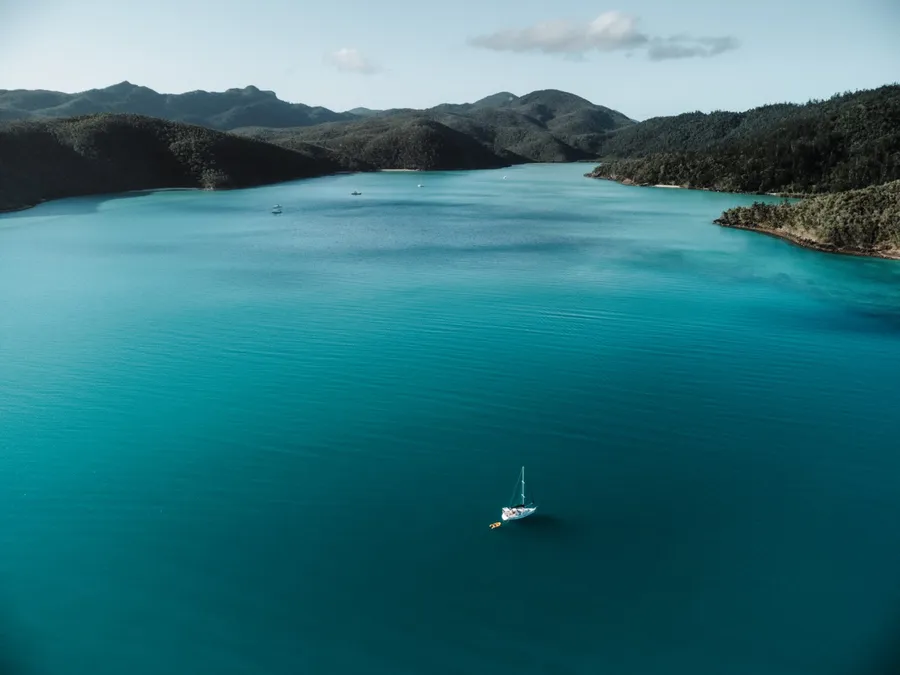 Calm protected anchorage in Nara Inlet with steep green hills and still water